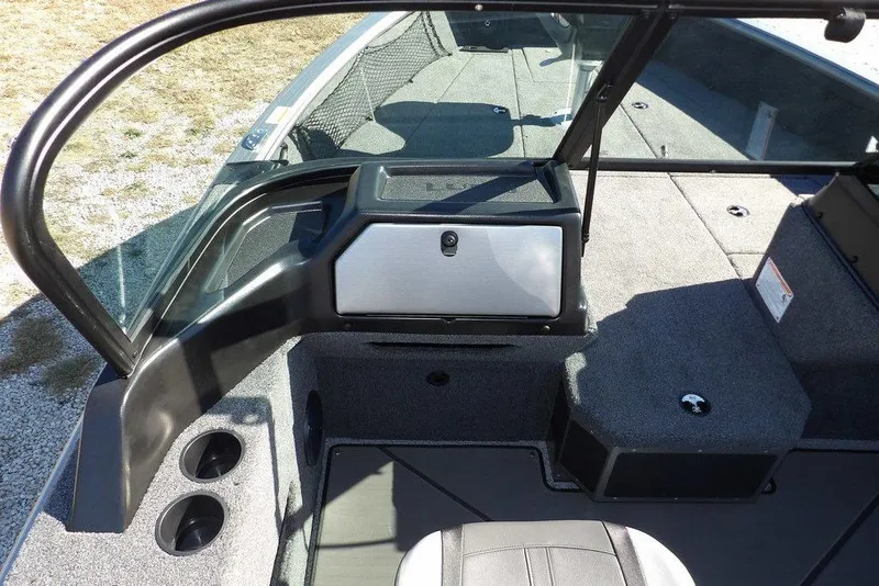 Slide: The Image of 2026 Lund 2075 Impact XS boat interior with seating and storage compartments. - 32