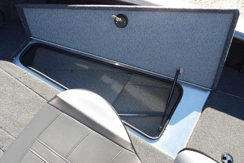 Slide: The Image of Open storage compartment in 2026 Lund 2075 Impact XS boat interior. - 42