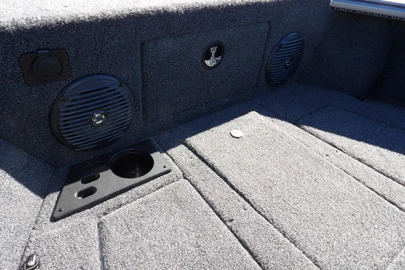 Slide: The Image of 2026 Lund 2075 Impact XS boat interior with speakers and cup holder. - 44