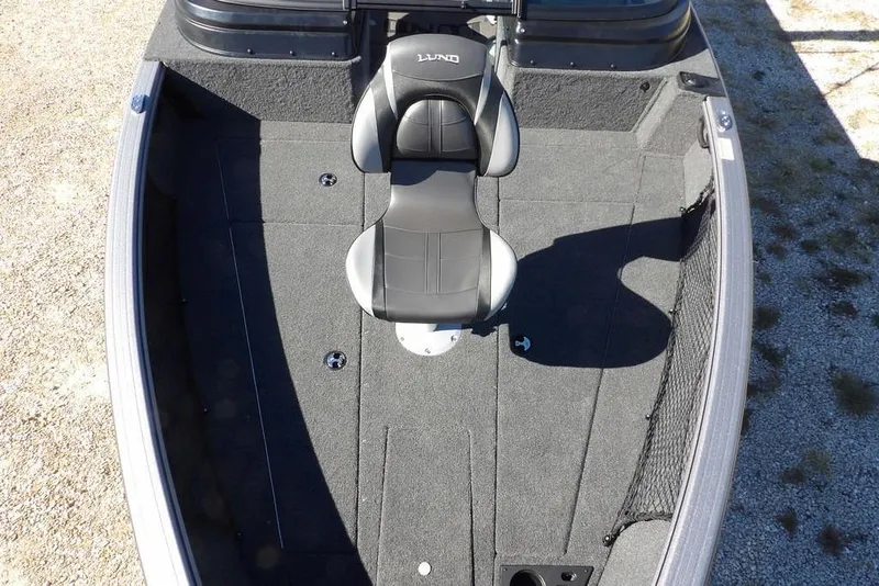 Slide: The Image of 2026 Lund 2075 Impact XS boat interior with single seat and spacious deck. - 45