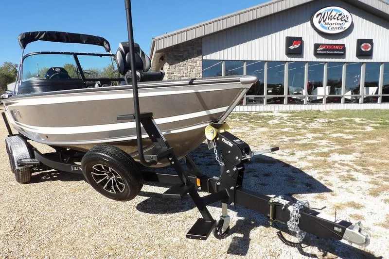 Slide: The Image of 2026 Lund 2075 Impact XS boat on trailer outside White's Marine Center. - 50