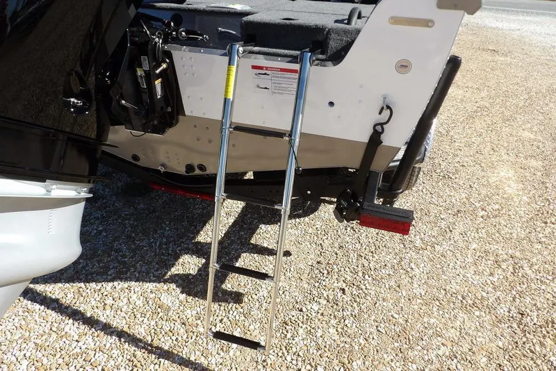 Slide: The Image of 2026 Lund 2075 Impact XS boat ladder on gravel surface. - 58