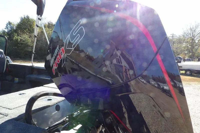 Slide: The Image of 2026 Lund 2075 Impact XS boat with Mercury Pro XS engine, outdoors in sunlight. - 59