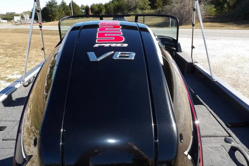 Slide: The Image of 2026 Lund 2075 Impact XS boat with 350 Pro V8 engine, rear view. - 60