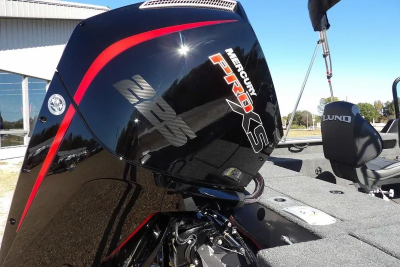 Slide: The Image of 2026 Lund 2075 Impact XS boat with Mercury Pro XS engine, outdoor setting. - 61