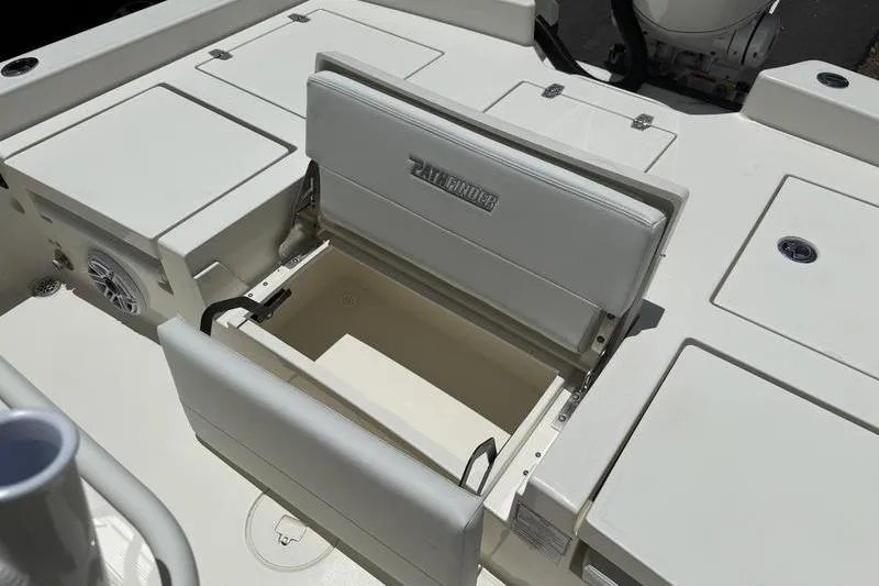Slide: The Image of 2025 Pathfinder 2600 TRS boat interior with open storage compartment and seating. - 12