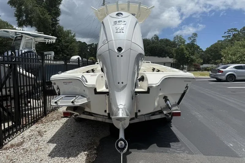 Slide: The Image of 2025 Pathfinder 2600 TRS boat with powerful outboard motor, parked outdoors. - 5