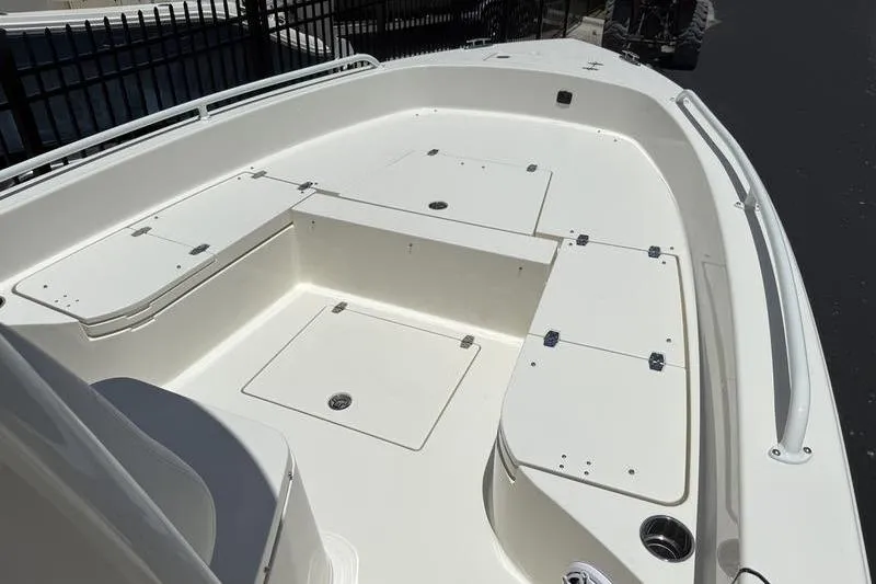 Slide: The Image of 2025 Pathfinder 2600 TRS boat deck with storage compartments and seating area. - 6
