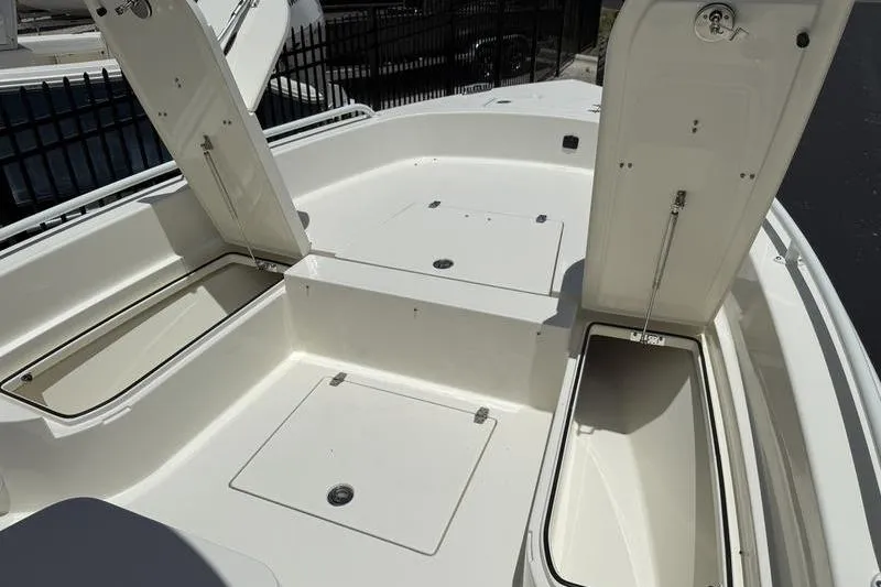 Slide: The Image of 2025 Pathfinder 2600 TRS boat deck with open storage compartments. - 7