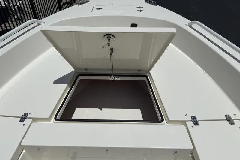 Slide: The Image of Open storage compartment on 2025 Pathfinder 2600 TRS boat deck. - 8