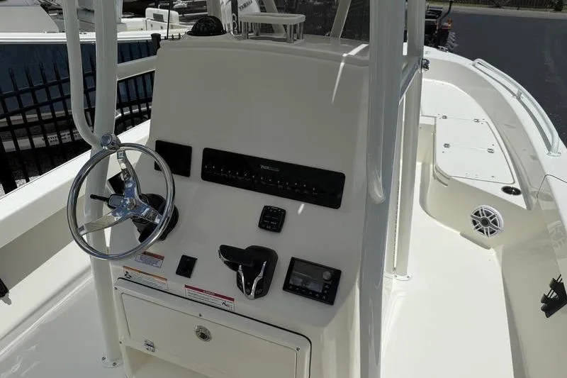 Slide: The Image of 2025 Pathfinder 2600 TRS boat console with steering wheel and controls. - 9