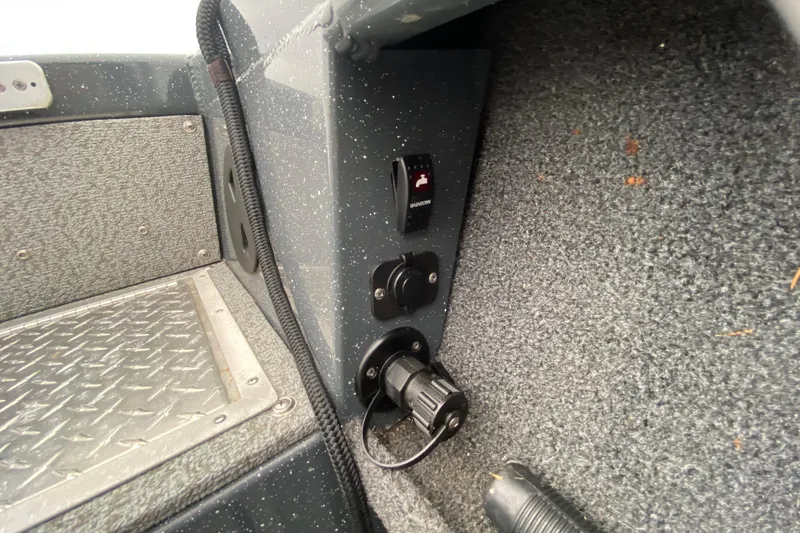 Slide: The Image of Interior view of a 2022 Duckworth 20XT Advantage boat showing control panel and textured flooring. - 15