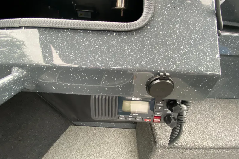 Slide: The Image of 2022 Duckworth 20XT Advantage dashboard with Uniden radio and textured surface. - 20