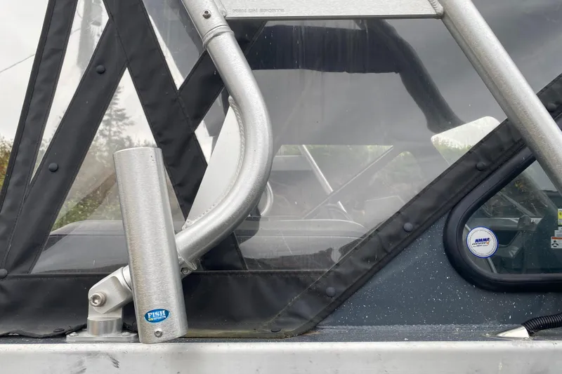Slide: The Image of 2022 Duckworth 20XT Advantage boat with rod holder and protective canopy. - 24