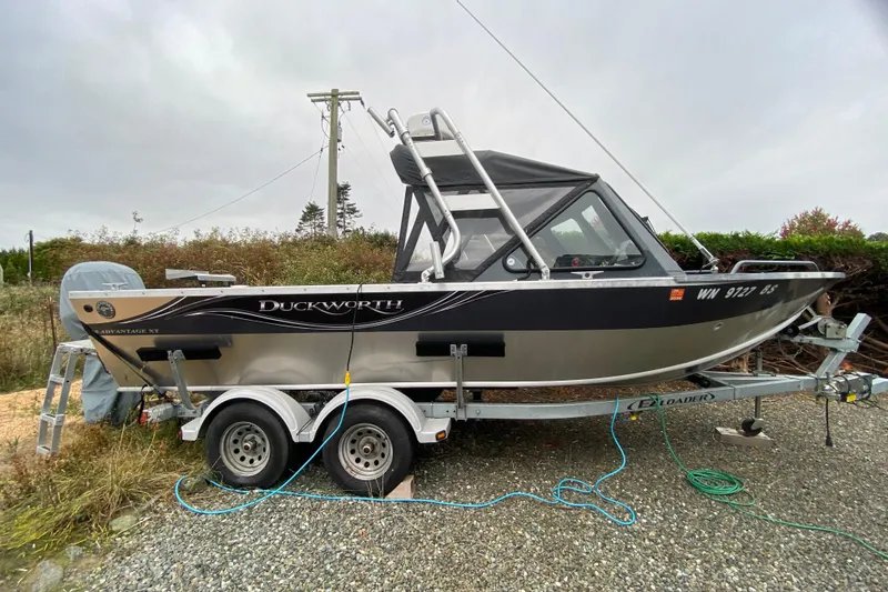 Slide: The Image of 2022 Duckworth 20XT Advantage boat on trailer, parked outdoors. - 4