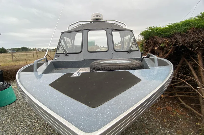 Slide: The Image of 2022 Duckworth 20XT Advantage boat with Garmin equipment, parked outdoors. - 6