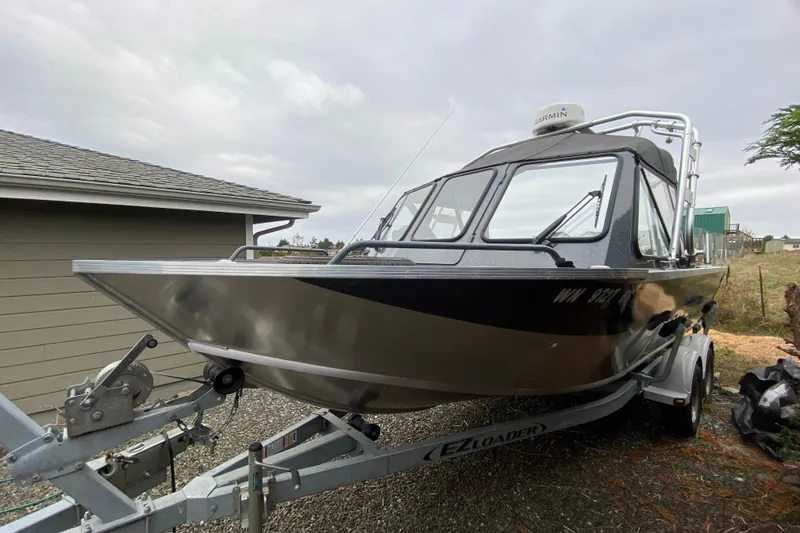 Slide: The Image of 2022 Duckworth 20XT Advantage boat on trailer, parked outdoors. - 7