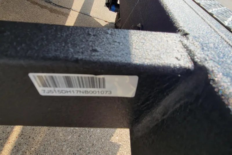 Slide: The Image of Close-up of a barcode on a 2022 Tahoe 185 S WT boat trailer. - 12