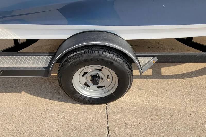 Slide: The Image of Trailer wheel of 2022 Tahoe 185 S WT boat on concrete surface. - 13