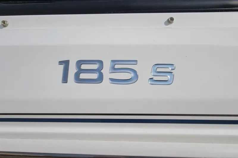 Slide: The Image of 2022 Tahoe 185 S WT boat emblem on white surface. - 14
