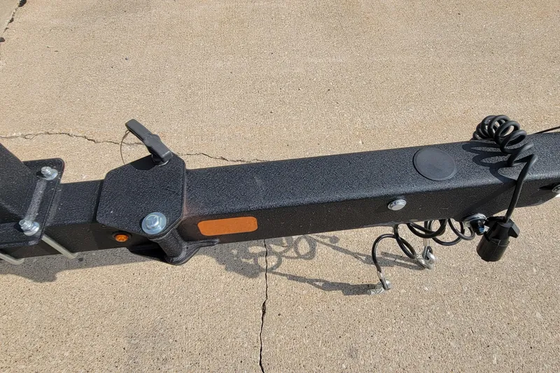 Slide: The Image of Trailer hitch of 2022 Tahoe 185 S WT boat on concrete surface. - 15