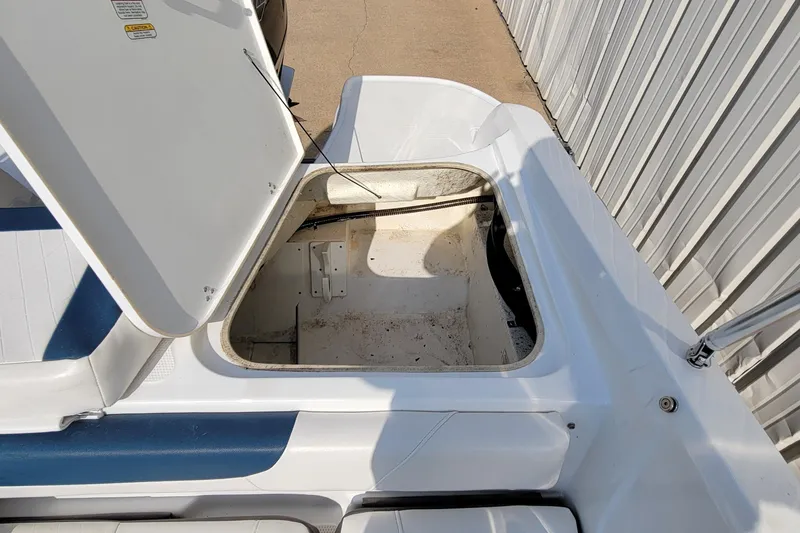 Slide: The Image of Open storage compartment on 2022 Tahoe 185 S WT boat, showing interior space. - 23