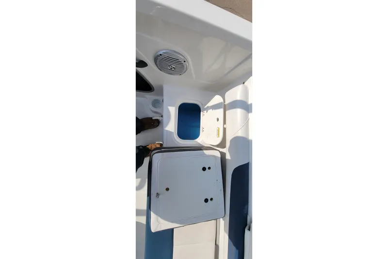 Slide: The Image of 2022 Tahoe 185 S WT boat interior with storage compartments and speaker. - 25