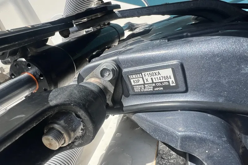 Slide: The Image of Close-up of Yamaha F150XA engine on 2015 Pursuit C 260 Center Console boat. - 15