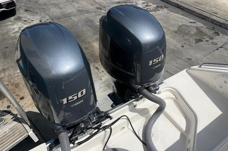 Slide: The Image of Twin Yamaha 150 outboard engines on a 2015 Pursuit C 260 Center Console boat. - 18