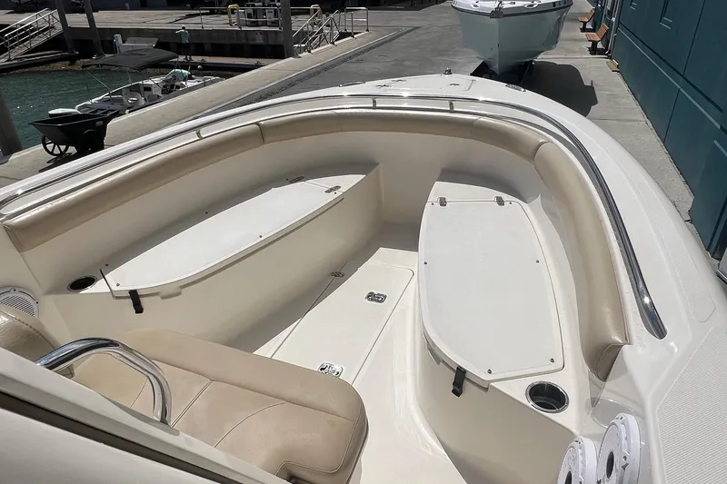 Slide: The Image of 2015 Pursuit C 260 Center Console boat interior with seating and storage compartments. - 9