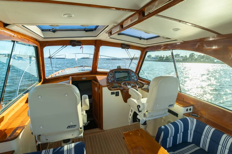 Slide: The Image of Interior of 2015 Hinckley Picnic Boat MK III with scenic water view. - 18