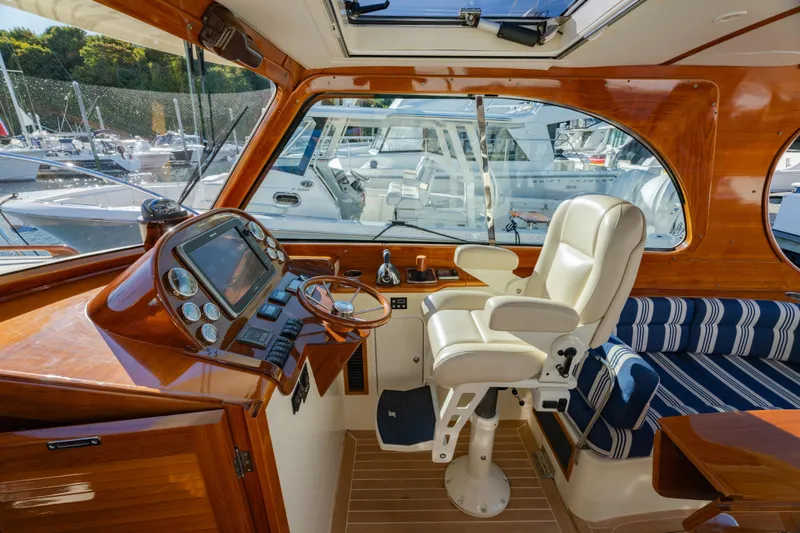 Slide: The Image of Interior of 2015 Hinckley Picnic Boat MK III with luxurious helm and seating. - 15