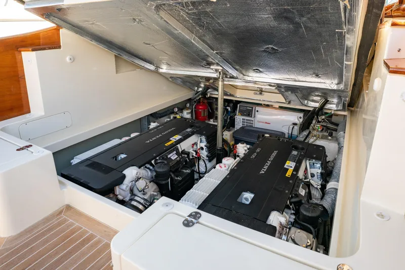 Slide: The Image of Engine compartment of a 2015 Hinckley Picnic Boat MK III, showcasing dual Volvo Penta engines. - 24