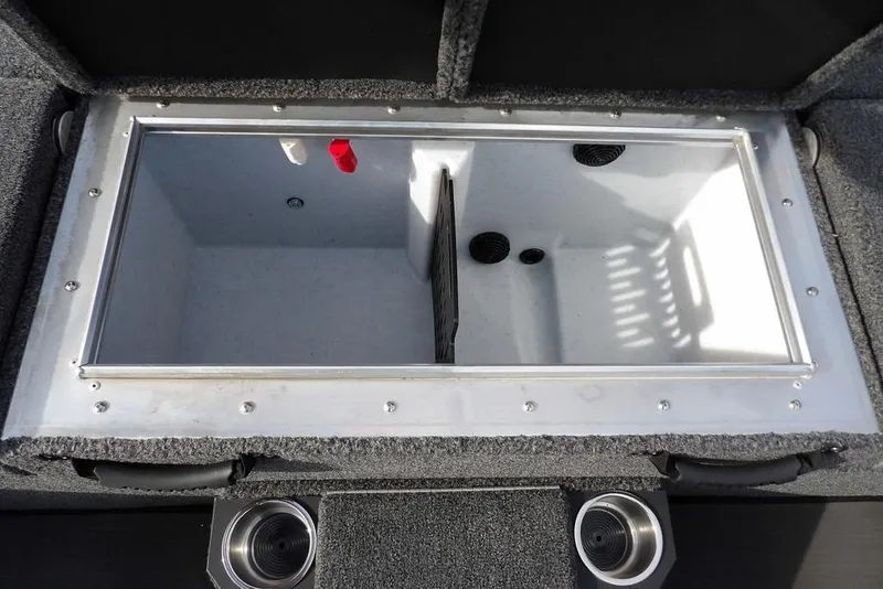 Slide: The Image of 2026 Lund 2075 Pro-V Bass XS livewell compartment with cup holders, showcasing interior design. - 13