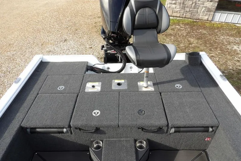 Slide: The Image of 2026 Lund 2075 Pro-V Bass XS boat with cushioned seating and storage compartments. - 16