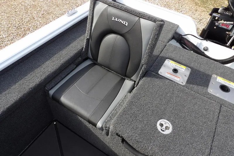 Slide: The Image of 2026 Lund 2075 Pro-V Bass XS boat seat with gray upholstery and storage compartments. - 18