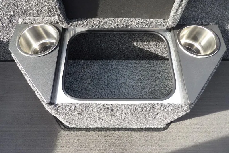 Slide: The Image of 2026 Lund 2075 Pro-V Bass XS boat interior with cup holders and storage compartment. - 21