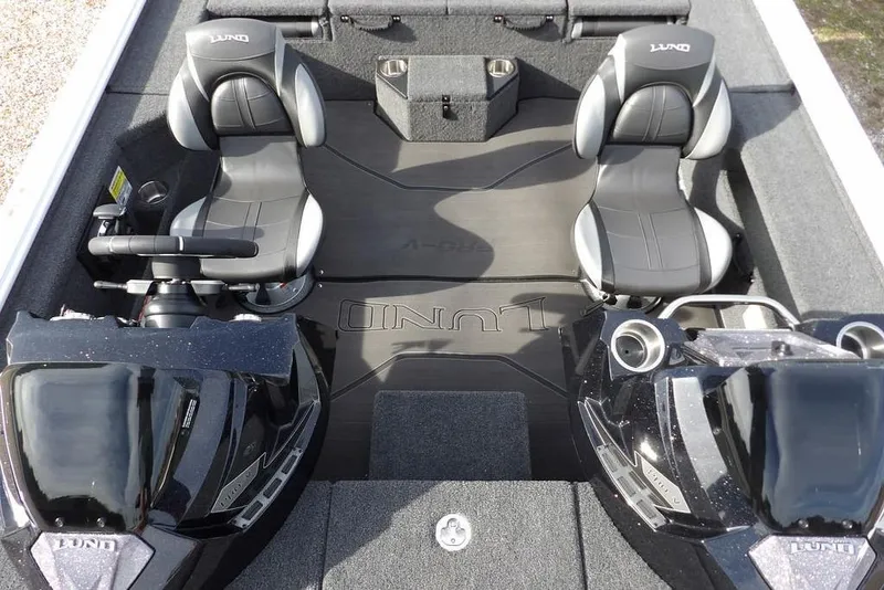 Slide: The Image of 2026 Lund 2075 Pro-V Bass XS boat interior with dual seats and steering console. - 24