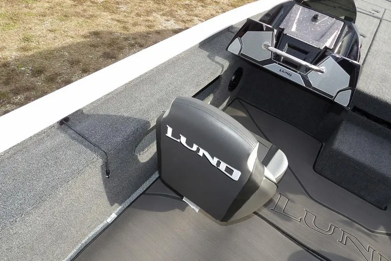 Slide: The Image of 2026 Lund 2075 Pro-V Bass XS boat interior with branded seat and console. - 25