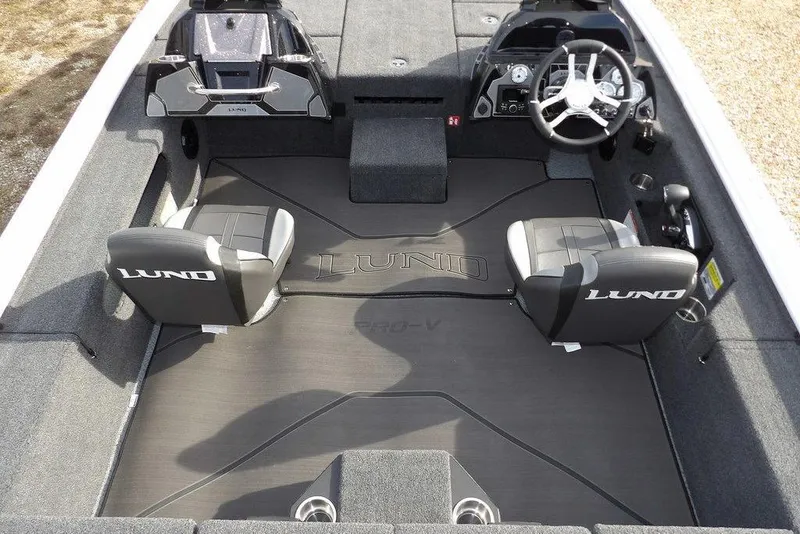 Slide: The Image of 2026 Lund 2075 Pro-V Bass XS boat interior with dual seats and steering console. - 26