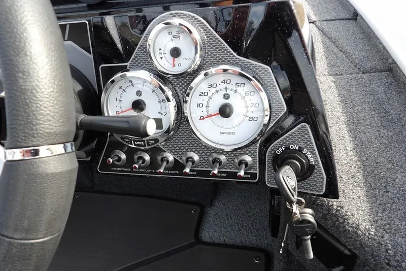 Slide: The Image of Dashboard of 2026 Lund 2075 Pro-V Bass XS boat with gauges and ignition keys. - 33