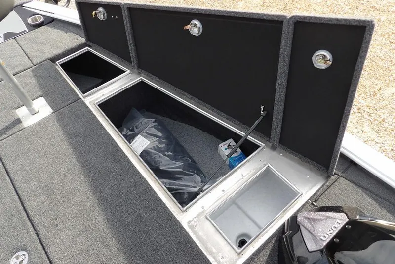Slide: The Image of 2026 Lund 2075 Pro-V Bass XS boat storage compartments open, showcasing interior space. - 38