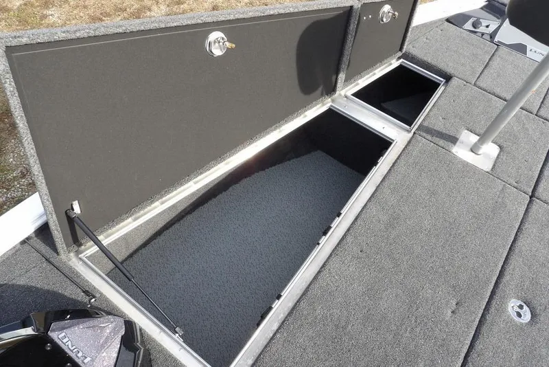 Slide: The Image of Open storage compartments on 2026 Lund 2075 Pro-V Bass XS boat deck. - 39