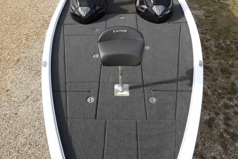 Slide: The Image of 2026 Lund 2075 Pro-V Bass XS boat deck with seat and storage compartments. - 42