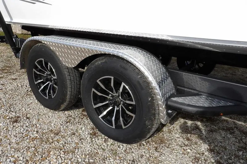 Slide: The Image of Trailer wheels of 2026 Lund 2075 Pro-V Bass XS on gravel surface. - 54