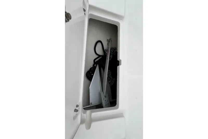 Slide: The Image of Anchor storage compartment on a 2019 Sea Born FX24 Bay boat. - 15