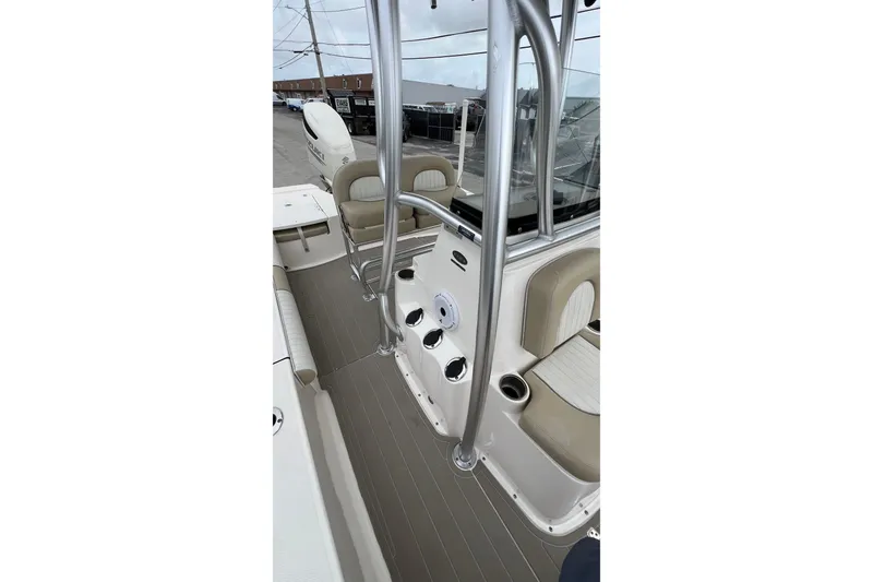 Slide: The Image of 2019 Sea Born FX24 Bay boat interior with seating and console details. - 21