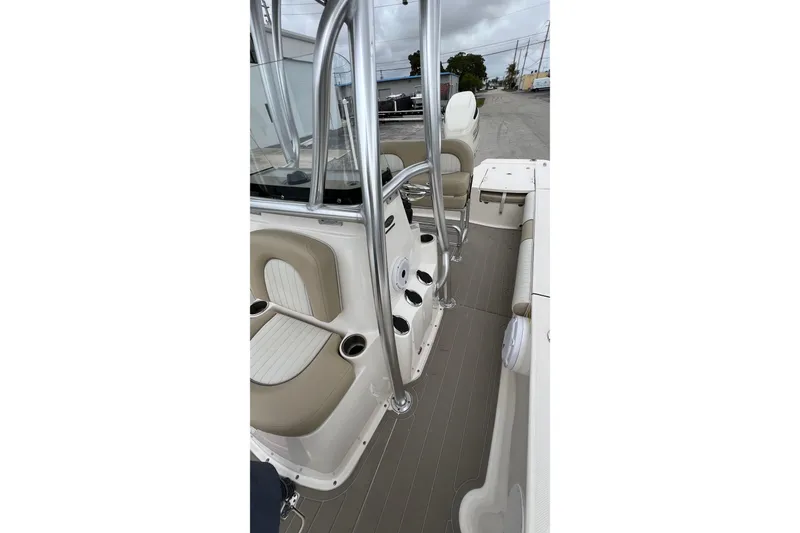 Slide: The Image of 2019 Sea Born FX24 Bay boat interior with seating and rod holders. - 22