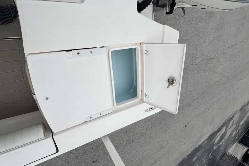 Slide: The Image of 2019 Sea Born FX24 Bay boat with open storage compartment on deck. - 25