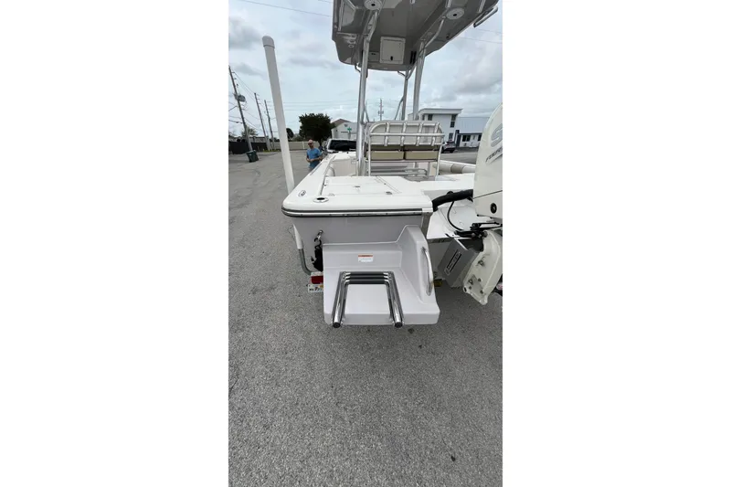 Slide: The Image of 2019 Sea Born FX24 Bay boat rear view with ladder on a street. - 7